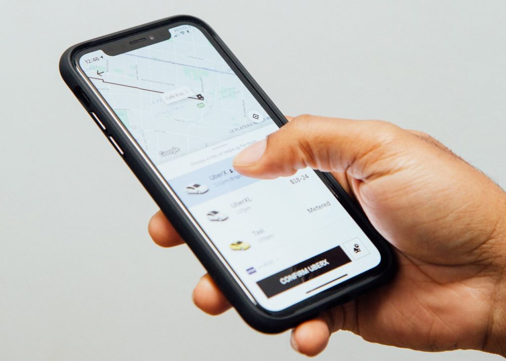 User booking taxi with Uber app